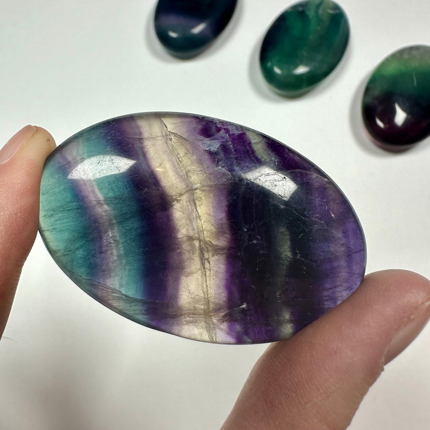 Rainbow fluorite palm stone (F)