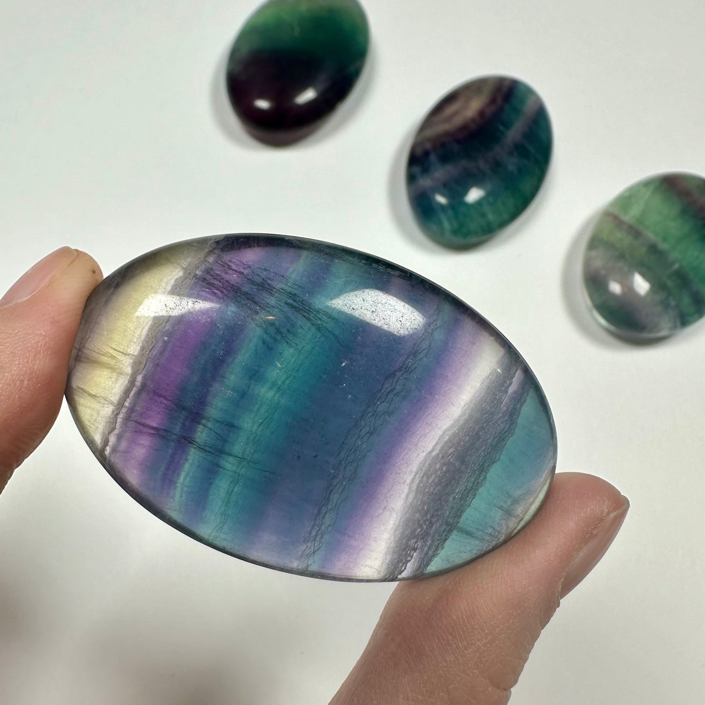 Rainbow fluorite palm stone (I)